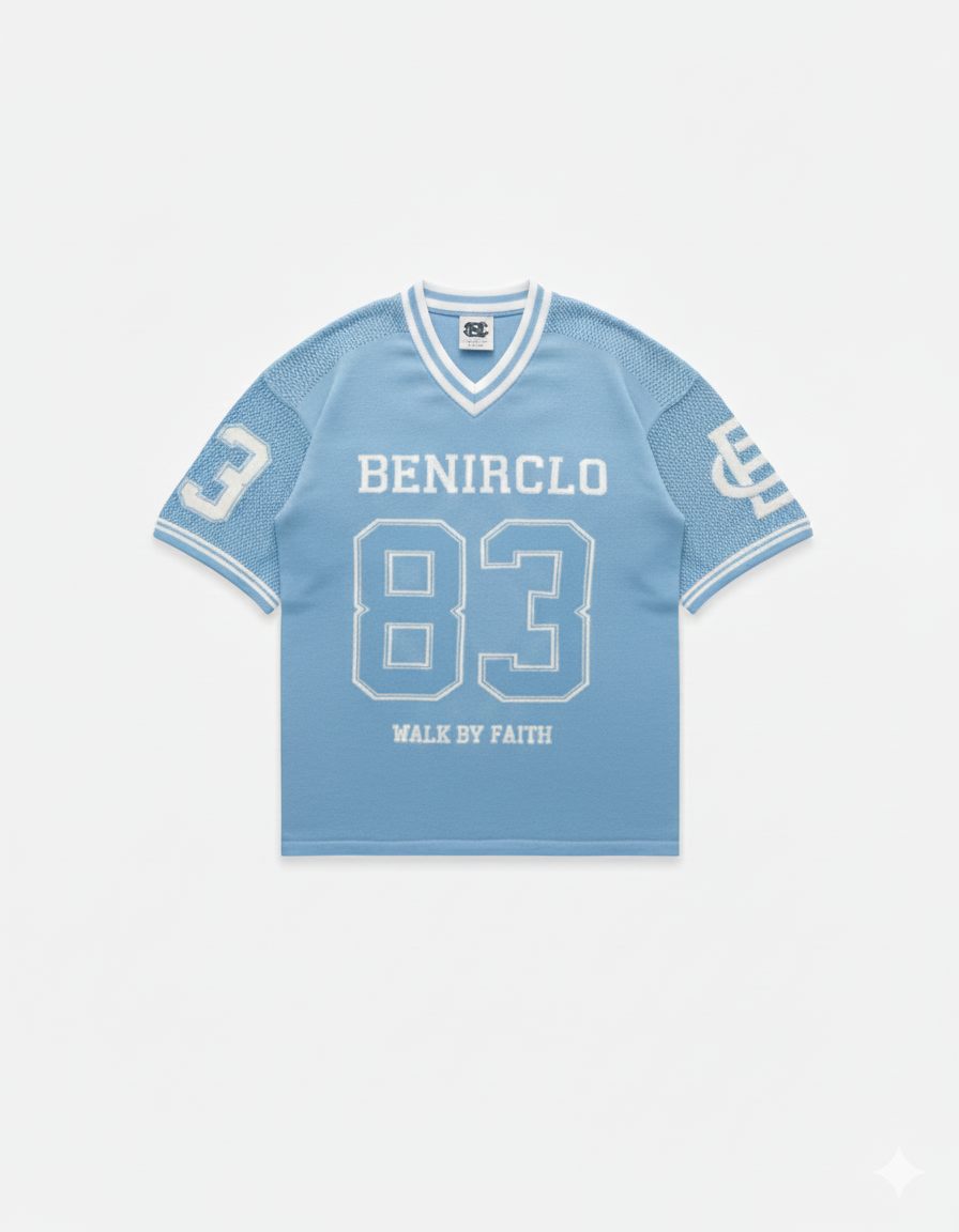 Benir Clothing light blue knit jersey with white 83 graphic, V-neck collar, and Walk By Faith text on front.